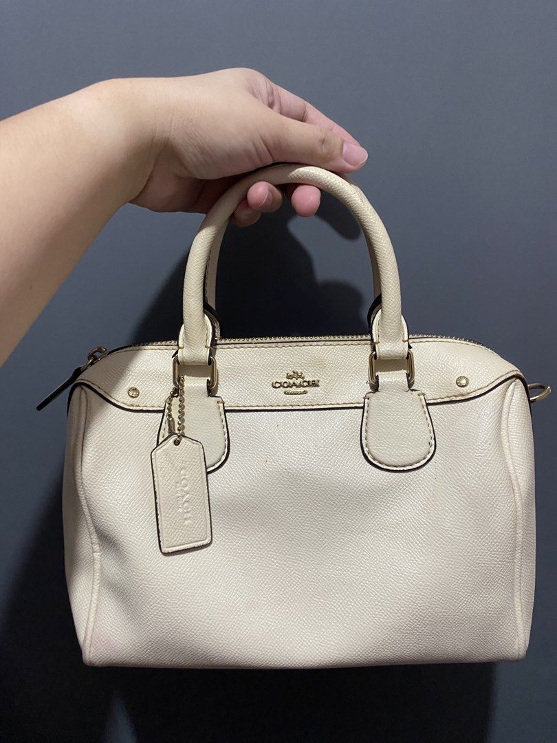 Coach Cream Pebbled Leather Satchel Bag (Category: Luxury Bags & Wallets) located in Batangas. Submitted by bagstolove3.0 (Listing ID 1452582964, Image 1). Description: - Cream colored Coach satchel bag - Pebbled leather exterior - Gold hardware accents - Top handles for comfortable carrying - Secure zip closure - Includes original Coach hangtag - Spacious interior, ideal for daily essentials - Versatile for everyday use No sling.