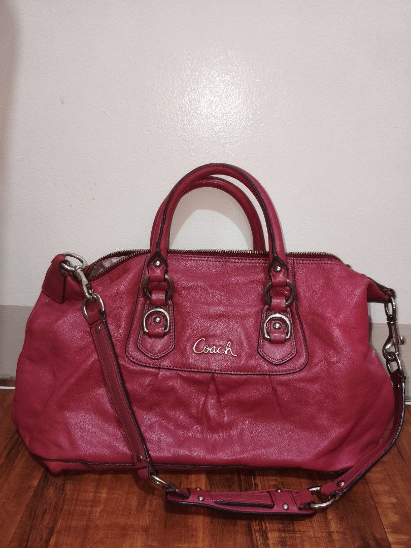 Coach Leather Handbag (Category: Luxury Bags & Wallets) located in Manila. Submitted by kari.pink (Listing ID 1452643235, Image 1). Description: - Authentic Coach handbag - Beautiful berry red color - Genuine leather material - Features top handles - Includes a detachable shoulder strap - Spacious interior for essentials - Secure zipper closure - Versatile for everyday or special occasions.