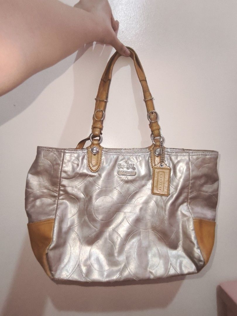 Coach Mia Embossed Leather Tote (Category: Luxury Bags & Wallets) located in Manila. Submitted by kari.pink (Listing ID 1452642062, Image 2). Description: preloved embossed coach mia! spot repainted some stains. Very pretty metallic coat! Favorite tote bag. Pm for vid!.