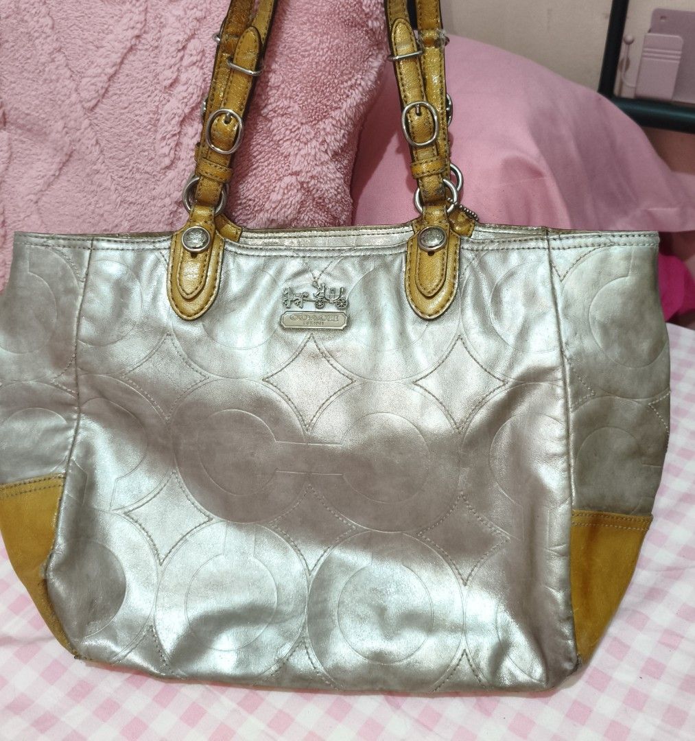 Coach Mia Embossed Leather Tote (Category: Luxury Bags & Wallets) located in Manila. Submitted by kari.pink (Listing ID 1452642062, Image 1). Description: preloved embossed coach mia! spot repainted some stains. Very pretty metallic coat! Favorite tote bag. Pm for vid!.