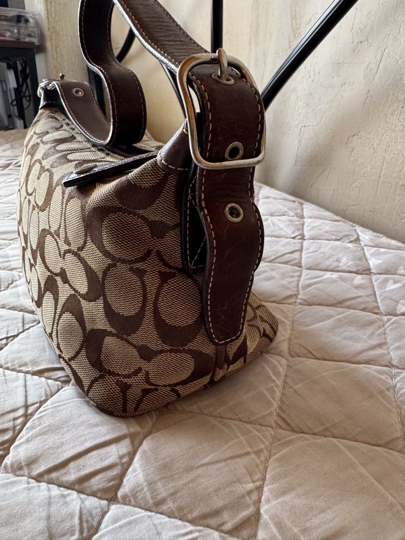 Coach Monogram vintage Brown (Category: Luxury Bags & Wallets) located in Danao, Cebu. Submitted by jojie.1983 (Listing ID 1452508929, Image 3). Description: original/authentic preloved vintage coach baguette small size adjustable strap no flaws expect minor sign of use only .