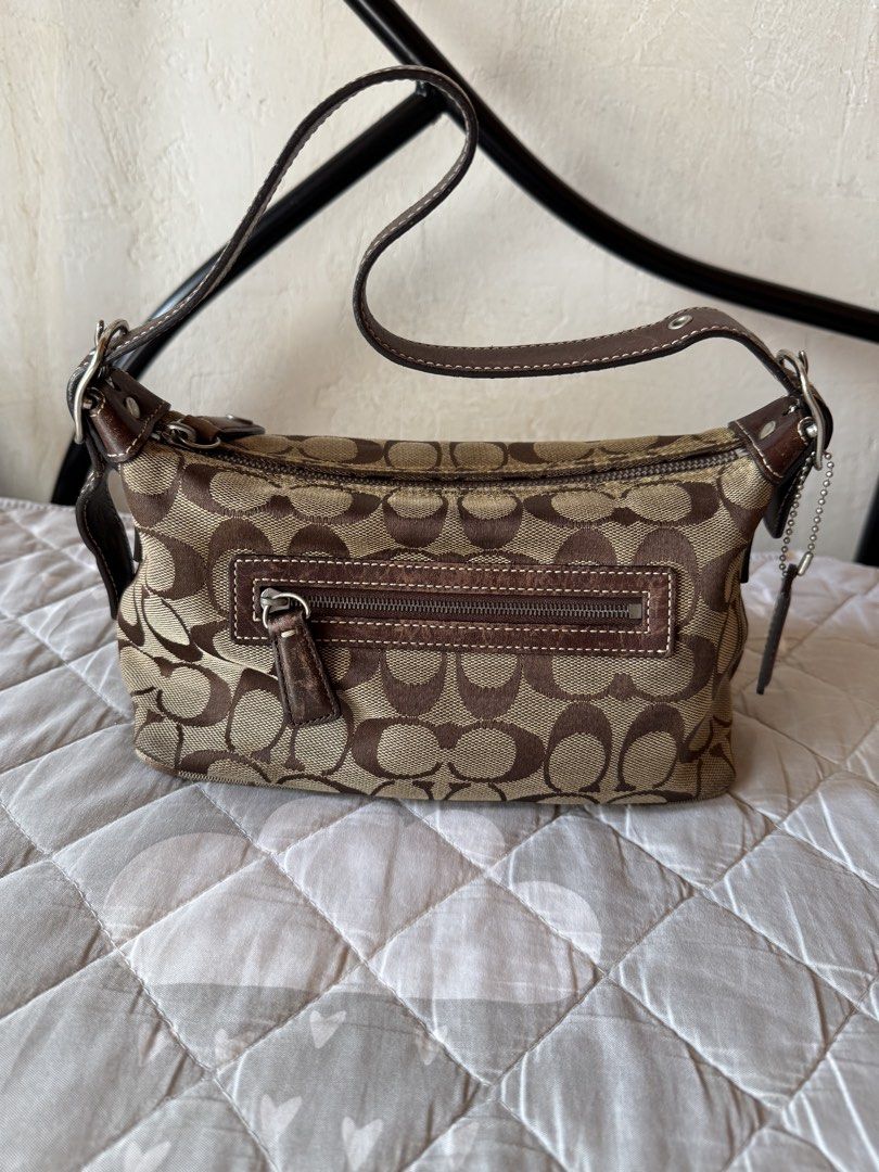 Coach Monogram vintage Brown (Category: Luxury Bags & Wallets) located in Danao, Cebu. Submitted by jojie.1983 (Listing ID 1452508929, Image 2). Description: original/authentic preloved vintage coach baguette small size adjustable strap no flaws expect minor sign of use only .