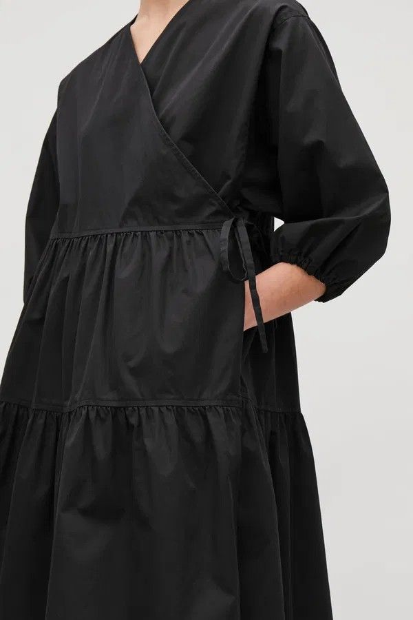 COS navy Tiered Midi Wrap Dress (Category: Dresses) located in Davao. Submitted by parenasnic86577 (Listing ID 1452609813, Image 2). Description: - navy midi dress - Tiered skirt - V-neckline - Wrap front with tie closure - Puff sleeves with elasticated cuffs - Made from crisp cotton poplin - Versatile for dressing up or down.
