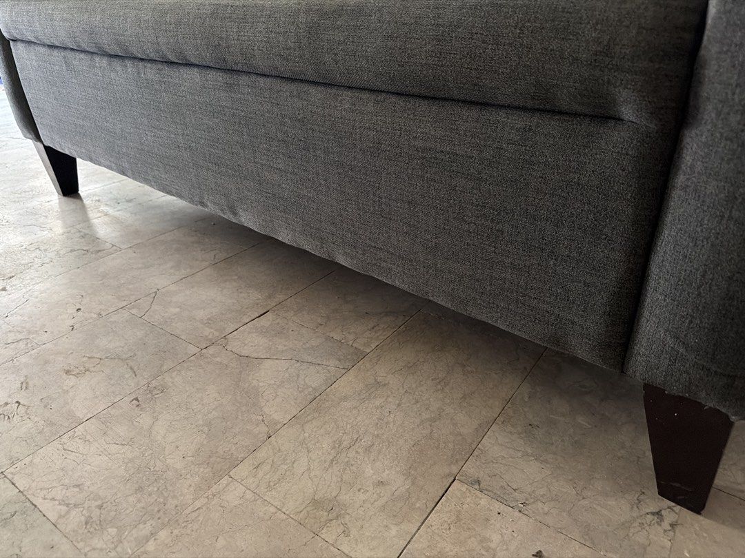 Dark Grey Two-Seater Sofa with Button Tufting (Category: Sofas) located in Manila. Submitted by uys958 (Listing ID 1452510181, Image 2). Description: - Dark grey two-seater sofa - Textured weave fabric - Button tufted back cushions - Dark wood legs - Simple, classic design - Ideal for living room or study.