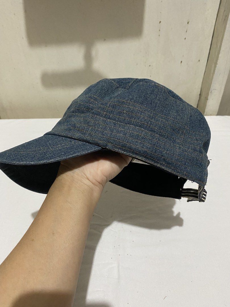 Denim Cap with Adjustable Strap (Category: Caps & Hats) located in Manila. Submitted by resi.diaz (Listing ID 1452593633, Image 3). Description: - some rust stain at the adjustable band. - Cool denim cap - Classic shape with curved brim - Adjustable strap at the back with striped detail - Ideal for casual wear - Versatile accessory, pairs easily with any outfit.