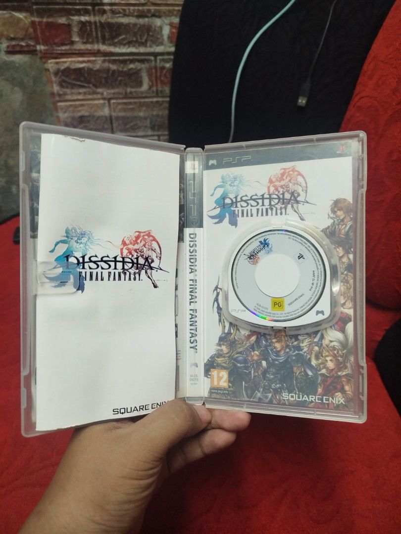 Dissidia Final Fantasy PSP Game Square Enix (Category: PlayStation) located in Binan City. Submitted by pumpkiiin02 (Listing ID 1452690104, Image 3). Description: - Dissidia Final Fantasy for PSP - Classic fighting game featuring iconic Final Fantasy characters - Comes with original case and manual - Perfect for fans of the Final Fantasy series.