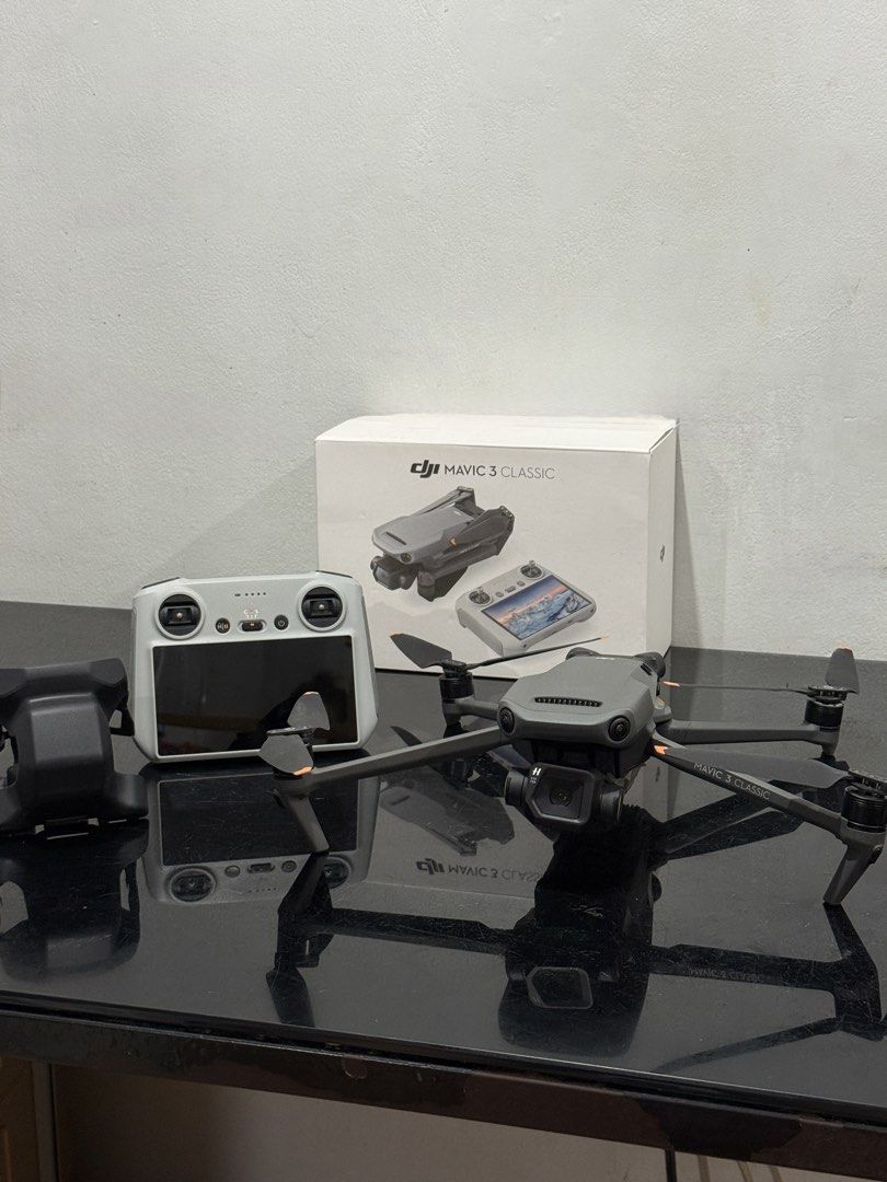 DJI Mavic 3 Classic with DJI RC Controller (Category: Drones) located in Manila. Submitted by cruzlaine22877 (Listing ID 1452531523, Image 3). Description: Almost new and in excellent condition. Price still negotiable as long as sure buyer. 😊 Specifications: * 4/3 CMOS Hasselblad Camera * 20MP photos * 5.1K video recording * Up to 46 minutes flight time * DJI RC with built-in screen * Omnidirectional obstacle sensing Condition: * Only 5 battery 