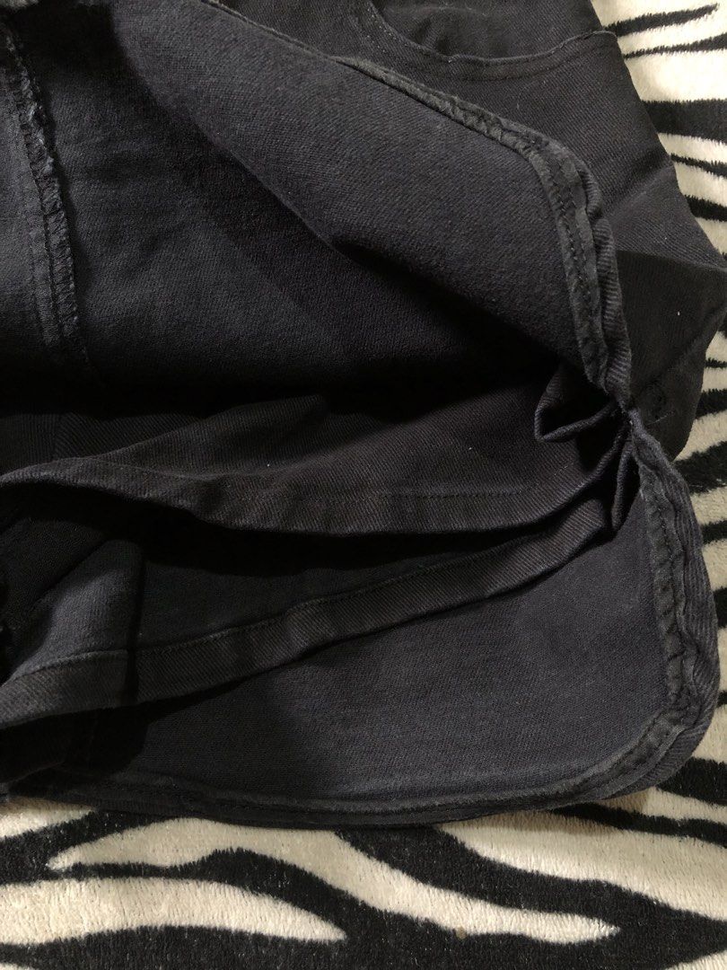 Dolphin Mini Skirt (Category: Skirts) located in Muntinlupa City. Submitted by ksclocollection (Listing ID 1452675919, Image 2). Description: Classic black denim mini skirt. Features front pockets, button/zip closure, and a curved hem. Perfect for casual looks. hard denim inner | heavy thick fabric •26-27 length 13.