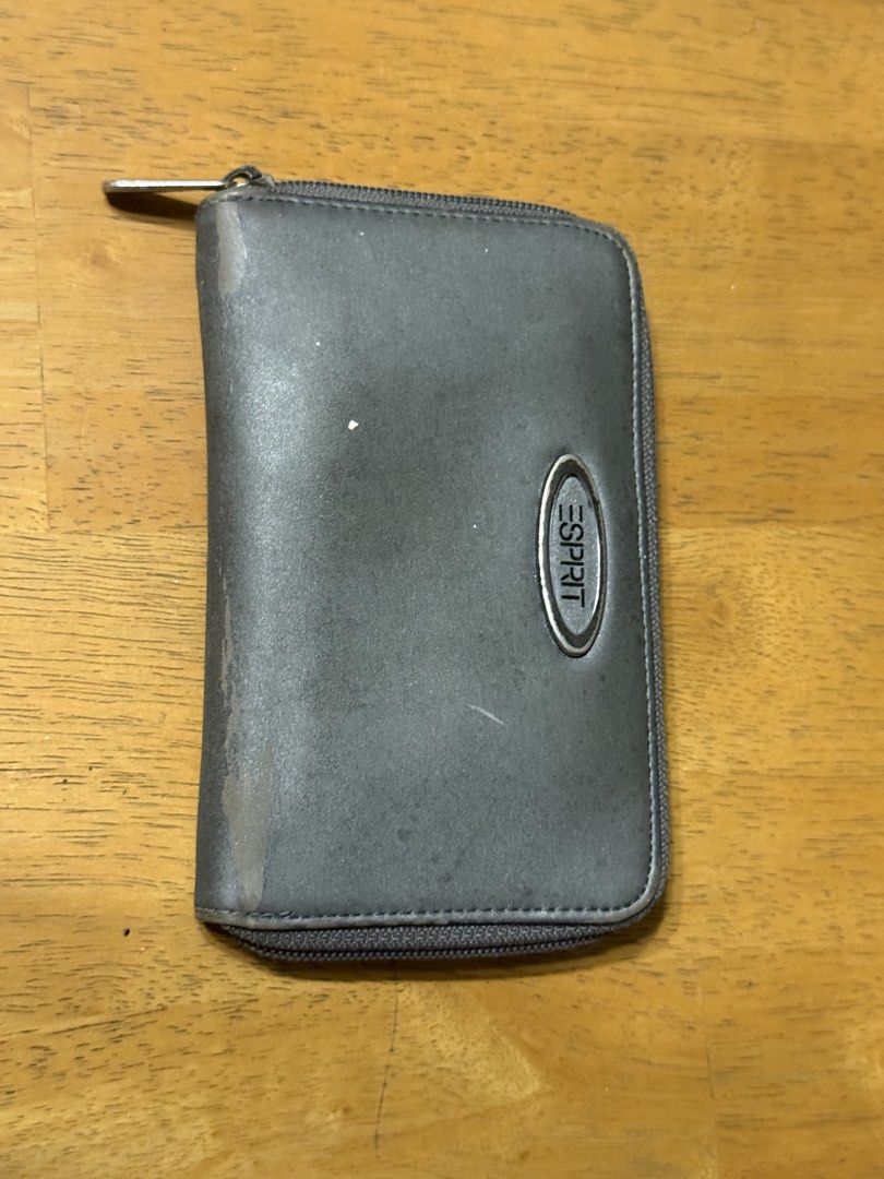 Esprit Zip Around Wallet Organizer (Category: Wallets & Card holders) located in Manila. Submitted by purchaeses (Listing ID 1452607140, Image 1). Description: - Esprit wallet with secure zip-around closure - Ample card slots for all your cards - Features a clear ID window for easy access - Perfect for organizing cash and cards - Shows some signs of wear on the exterior - Zipper operates smoothly - Needs cleaning.