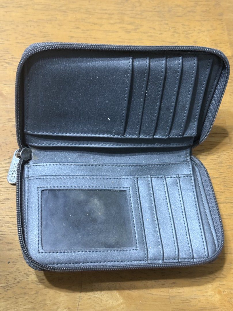 Esprit Zip Around Wallet Organizer (Category: Wallets & Card holders) located in Manila. Submitted by purchaeses (Listing ID 1452607140, Image 2). Description: - Esprit wallet with secure zip-around closure - Ample card slots for all your cards - Features a clear ID window for easy access - Perfect for organizing cash and cards - Shows some signs of wear on the exterior - Zipper operates smoothly - Needs cleaning.