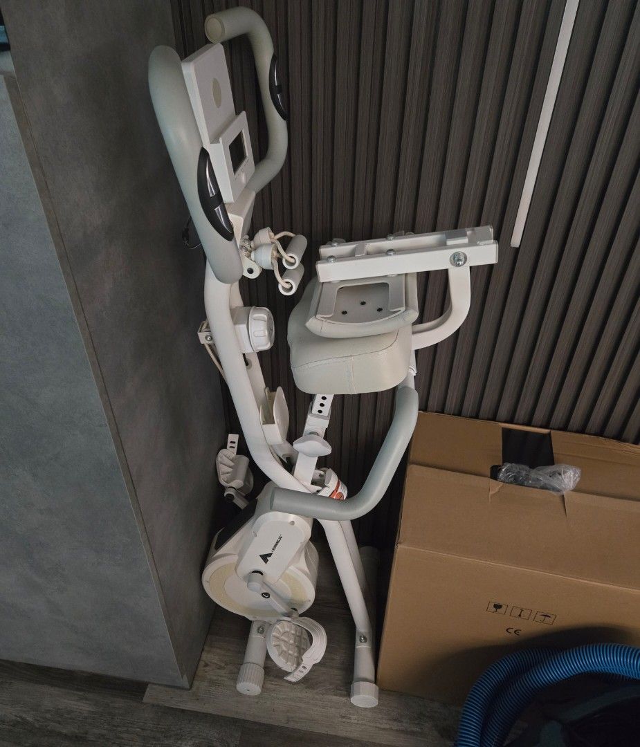 Exercise Machine (Category: Cardio & Fitness Machines) located in Singapore. Submitted by bicobs (Listing ID 1452696849, Image 1). Description: - Exercise machine - White frame - Padded seat and handlebars - Adjustable pedals - Suitable for leg and cardio workouts - Ready for a new home.