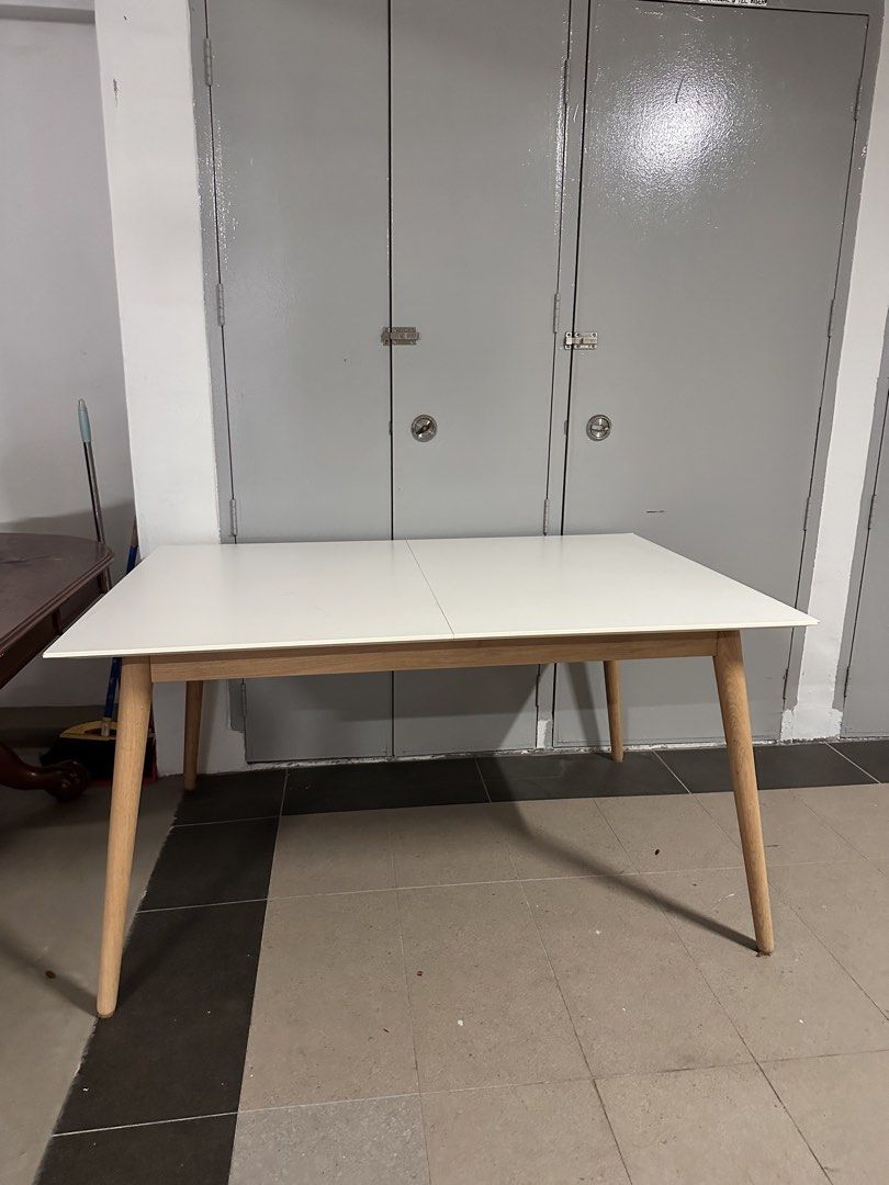Expandable Dining Table (Category: Tables & Sets) located in Singapore. Submitted by yousteadyisteady247 (Listing ID 1452672096, Image 2). Description: Expandable dining table up for sale. Without expansion, approx 1.4m/140cm With extension, 1.8m/180cm Width - 100cm! Fits up to 6-8 people comfortably. Only table. Arrange your own transport/ I have contact to deliver the table at your own expense. Price negotiable. .
