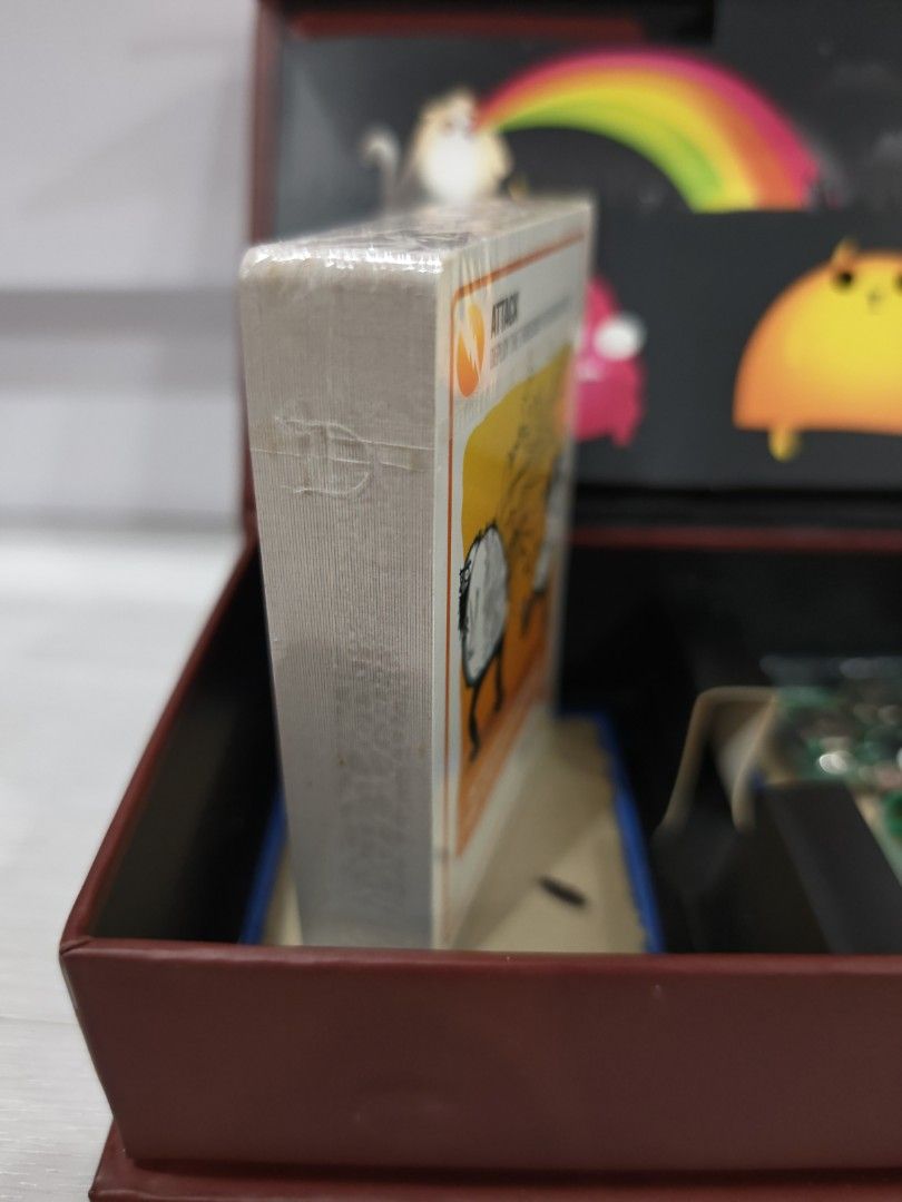 Exploding Kittens Card Game (Category: Board Games & Puzzles) located in Singapore. Submitted by mizmi (Listing ID 1452535986, Image 4). Description: Original launch edition. Brand new in box, card sealed and unopened. Clearing store. First come first served, self collect or Carousell SPX delivery paid by buyer. - Exploding Kittens: The card game of kitty-powered Russian Roulette! - Strategic gameplay: Draw cards, avoid the Exploding Kitten. - De
