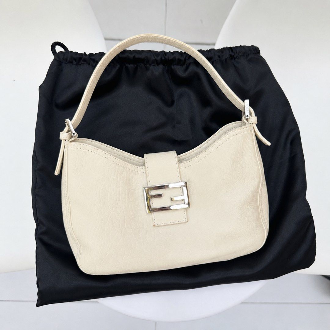 Fendi Cream Leather Baguette Bag (Category: Luxury Bags & Wallets) located in Pasig City. Submitted by miss_abuelita (Listing ID 1452670490, Image 2). Description: LIMITED EDITION RARE ITEM Authentic Cream Fendi Baguette Bag Comes with dustbag and coa Flaw: -has small stain on the back not seen when worn -signs of usage kn strap not visible much Rank: B/AB .