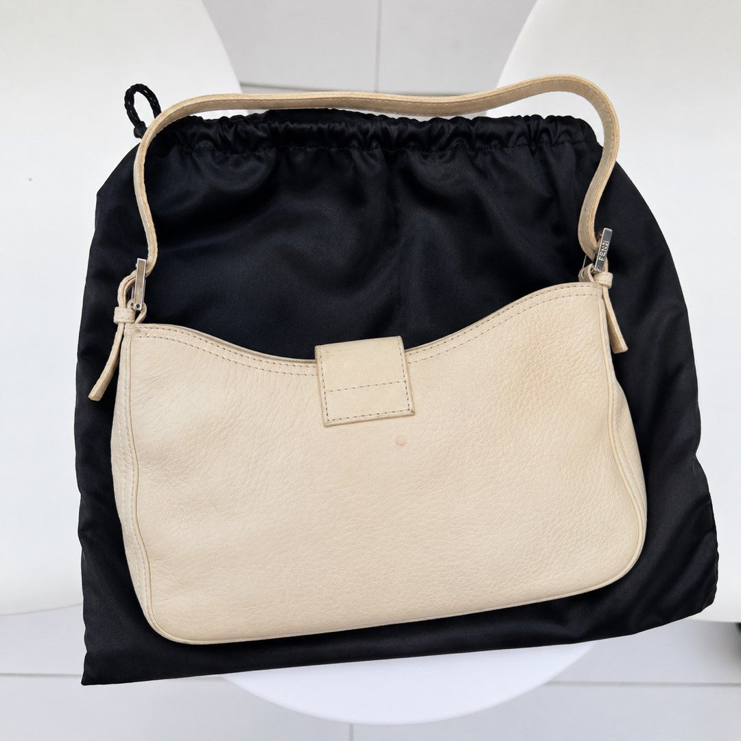 Fendi Cream Leather Baguette Bag (Category: Luxury Bags & Wallets) located in Pasig City. Submitted by miss_abuelita (Listing ID 1452670490, Image 3). Description: LIMITED EDITION RARE ITEM Authentic Cream Fendi Baguette Bag Comes with dustbag and coa Flaw: -has small stain on the back not seen when worn -signs of usage kn strap not visible much Rank: B/AB .