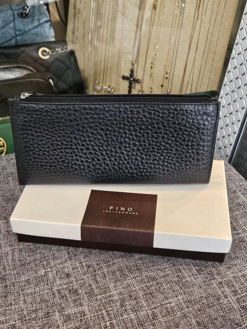 FINO Leatherware Black Textured Long Wallet with Box (Category: Wallets & Card holders) located in Makati City. Submitted by pusturah (Listing ID 1452672946, Image 1). Description: - FINO black textured long wallet - Includes original box - Ample space for cards and cash - Secure zipper closure - Ideal for everyday use.