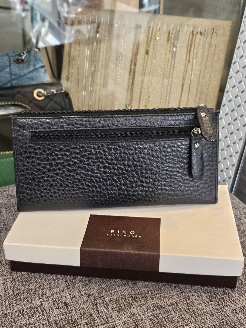 FINO Leatherware Black Textured Long Wallet with Box (Category: Wallets & Card holders) located in Makati City. Submitted by pusturah (Listing ID 1452672946, Image 3). Description: - FINO black textured long wallet - Includes original box - Ample space for cards and cash - Secure zipper closure - Ideal for everyday use.