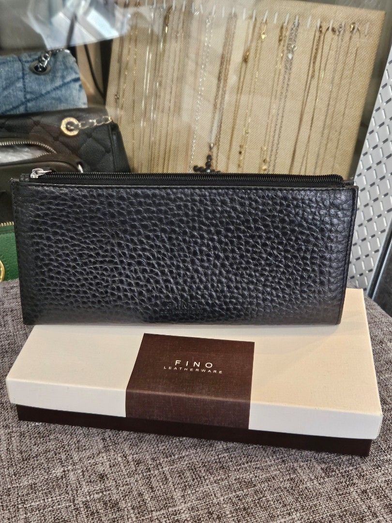FINO Leatherware Black Textured Long Wallet with Box (Category: Wallets & Card holders) located in Makati City. Submitted by pusturah (Listing ID 1452672946, Image 2). Description: - FINO black textured long wallet - Includes original box - Ample space for cards and cash - Secure zipper closure - Ideal for everyday use.