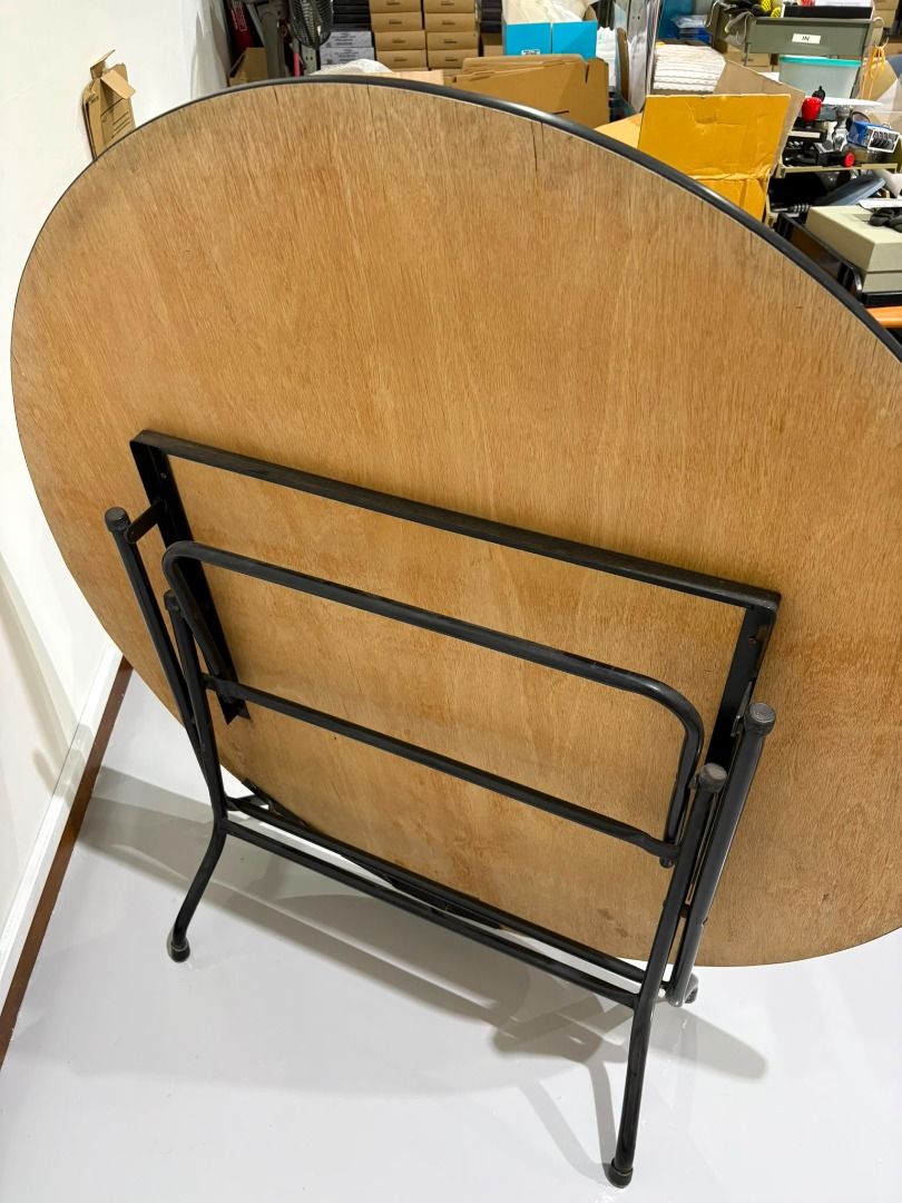 Foldable Table (Category: Tables & Sets) located in Singapore. Submitted by ybpreweddingco (Listing ID 1452594855, Image 3). Description: - Foldable table - Wooden top - Black legs - Space-saving design - Easy to store - Suitable for various uses (dining, study, crafts).