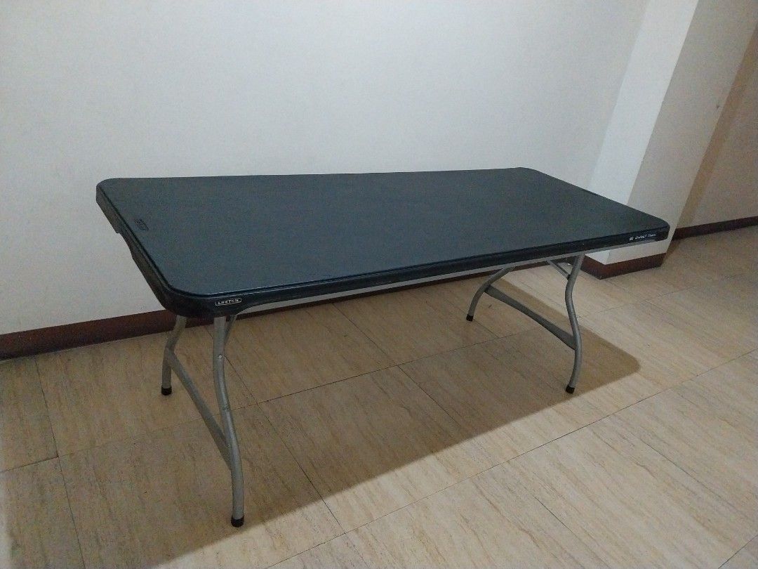 Folding Table - Durable Plastic Top, Metal Legs (Category: Tables & Sets) located in Makati City. Submitted by 88acres (Listing ID 1452529317, Image 1). Description: - Sturdy folding table - Dark grey plastic top - Silver metal legs - Folds flat for easy storage - Ideal for events, extra workspace, or dining - Legs feature protective rubber caps - we have ten pcs available.