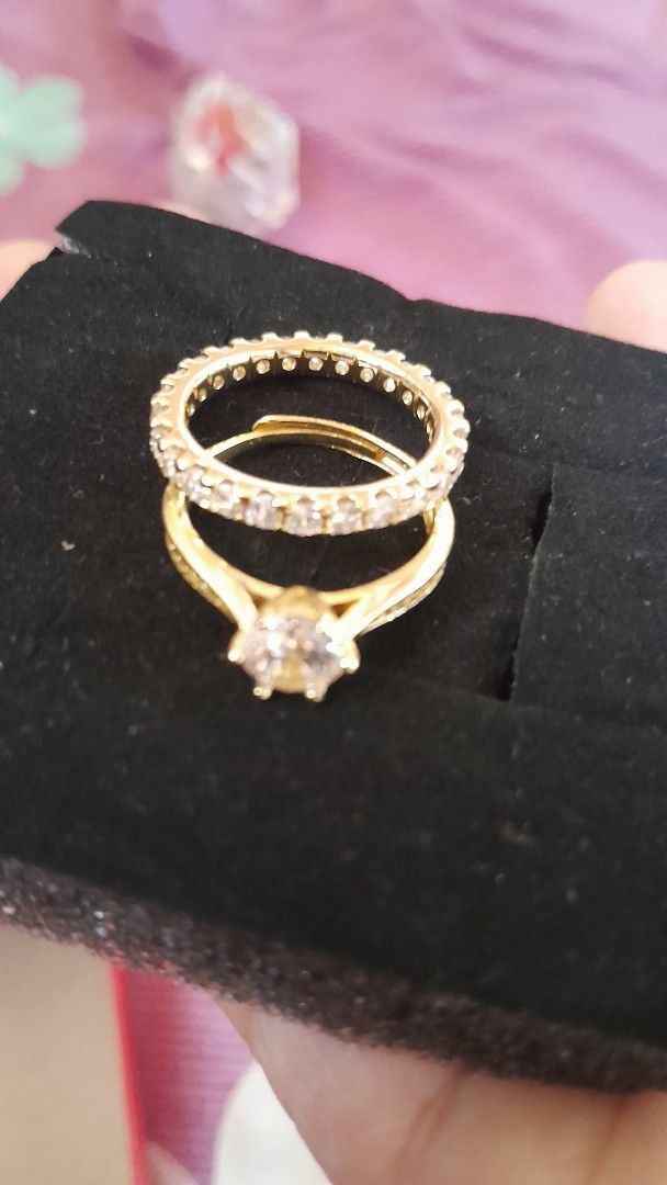 Gold Diamond Ring Set with Engagement Ring (Category: Rings) located in Butuan. Submitted by atab63699 (Listing ID 1452585700, Image 2). Description: - Two-piece gold-toned ring set - Solitaire engagement ring with a band full of small stones - Comes in a red jewelry box - Ideal for proposals or as a gift with markings.