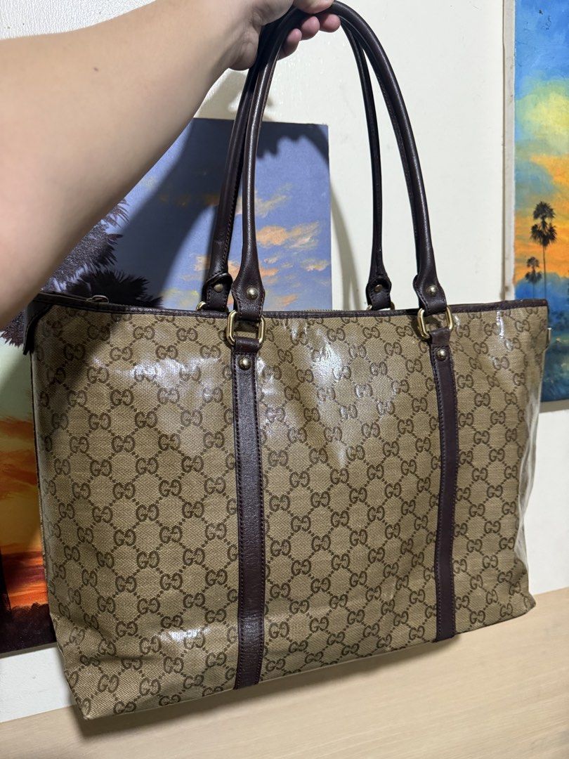 Gucci GG Monogram Coated Canvas Tote Bag (Category: Luxury Bags & Wallets) located in Quezon City. Submitted by vianca13 (Listing ID 1452534222, Image 2). Description: - Classic GG monogram pattern (beige/brown) - Coated canvas with leather trim - Zip top closure - Interior zip pocket - Interior snap button pocket - Serial number: M109993 197750 - Ideal for everyday use or travel.