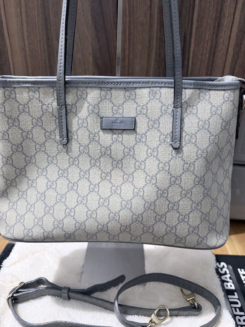 Gucci GG Supreme Small Joy Tote Bag (Category: Luxury Bags & Wallets) located in Manila. Submitted by prelovedbygayle (Listing ID 1452669613, Image 2). Description: GG Supreme Canvas: Crafted from iconic coated microfiber canvas featuring the repeated interlocking GG monogram in a sleek beige and grey color palette. Grey Leather Trim: Outfitted with refined grey leather top handles, matching upper rim piping, and a small centered leather logo pla