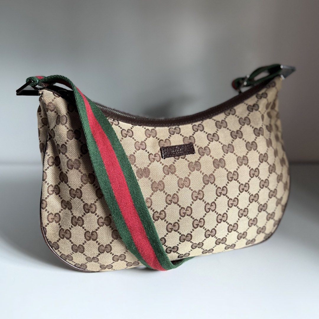 Gucci Sherryline Ophidia web hobo shoulder bag (Category: Luxury Bags & Wallets) located in Quezon City. Submitted by ksumer (Listing ID 1452625074, Image 1). Description: - Authentic Gucci shoulder bag - Classic GG monogram canvas - Iconic red and green stripe detail on strap - Genuine leather trim and strap - Silver hardware with Gucci logo buckle - Stylish and versatile for everyday use.