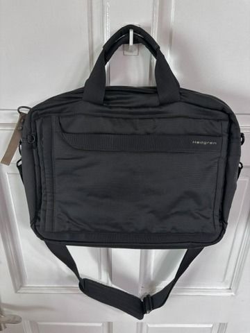 Hedgren Black Laptop Bag with Shoulder Strap (Category: Laptop Bags & Sleeves) located in Mandaluyong City. Submitted by rizaldyquirino (Listing ID 1452694297, Image 2). Description: - Brand: Hedgren - Color: Black - Features: Top handles, detachable shoulder strap - Interior: Plenty of space for essentials - Ideal for: Work or travel - Material: Durable - Design: Clean and simple.