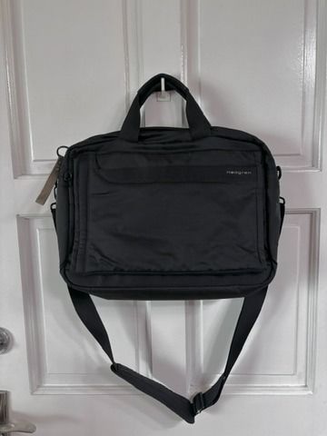 Hedgren Black Laptop Bag with Shoulder Strap (Category: Laptop Bags & Sleeves) located in Mandaluyong City. Submitted by rizaldyquirino (Listing ID 1452694297, Image 1). Description: - Brand: Hedgren - Color: Black - Features: Top handles, detachable shoulder strap - Interior: Plenty of space for essentials - Ideal for: Work or travel - Material: Durable - Design: Clean and simple.