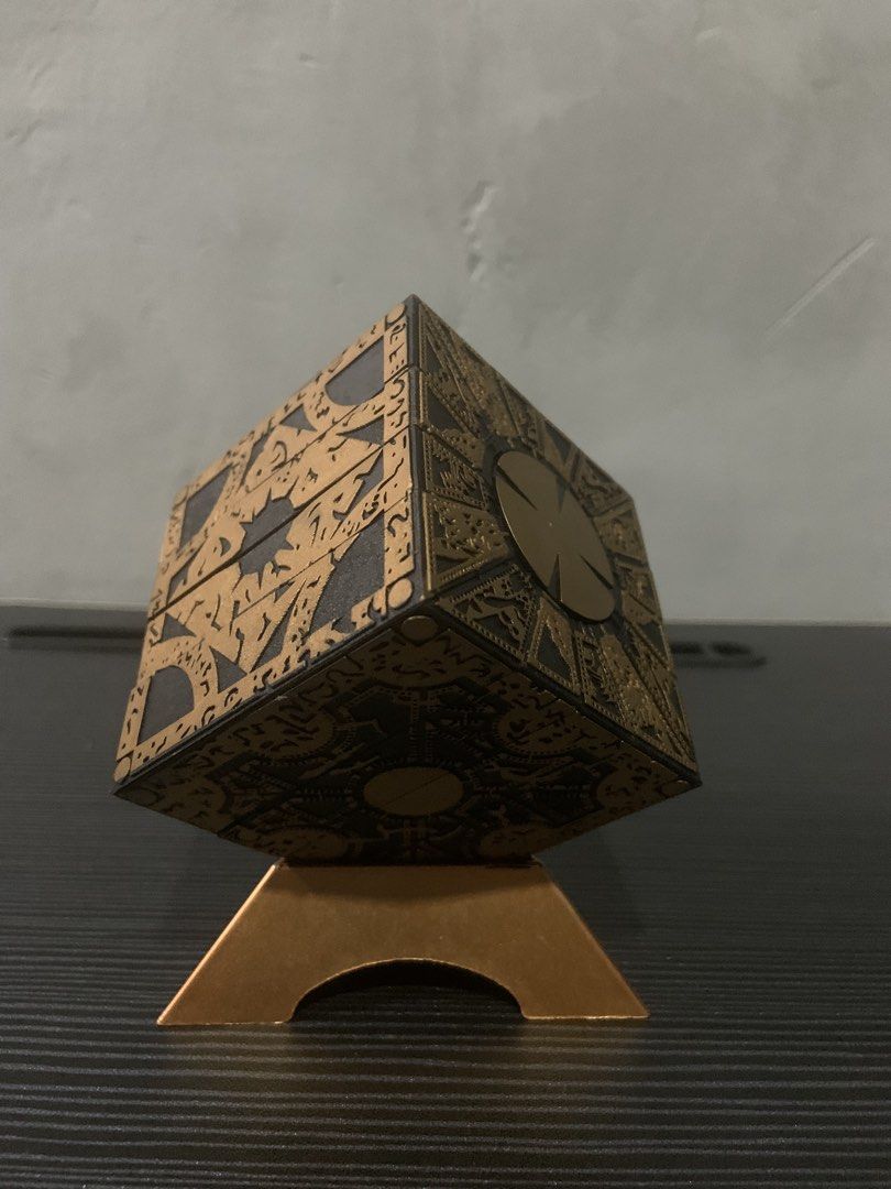 Hellraiser Puzzle Replica (Category: Board Games & Puzzles) located in Cavite. Submitted by krydeclutter (Listing ID 1452602217, Image 2). Description: - Recreated Lament Configuration puzzle box from Hellraiser - Intricate details on all sides - Comes with a display stand - Perfect for fans of the movie franchise - Unique collectible for horror enthusiasts - Measures approximately 3x3 inches.