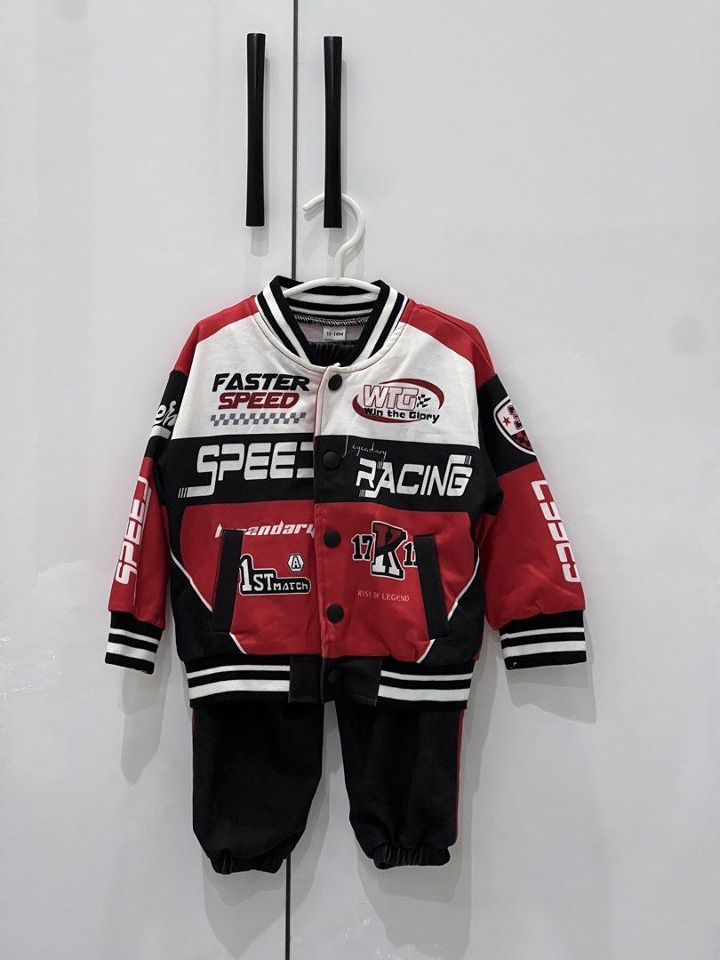Kids' Racing Jacket and Pants Set 12-18M (Category: Babies & Kids Fashion) located in Bulacan. Submitted by levixxx (Listing ID 1452580677, Image 1). Description: - Racing-themed jacket and pants set for kids. - Size: 12-18 months. - Jacket features 'Faster Speed' and 'Speed Racing' graphics. - Jacket color: Red, white, and black with ribbed cuffs and hem. - Pants color: Black. - Ideal for active toddlers who love speed. Used for pictorial only 1
