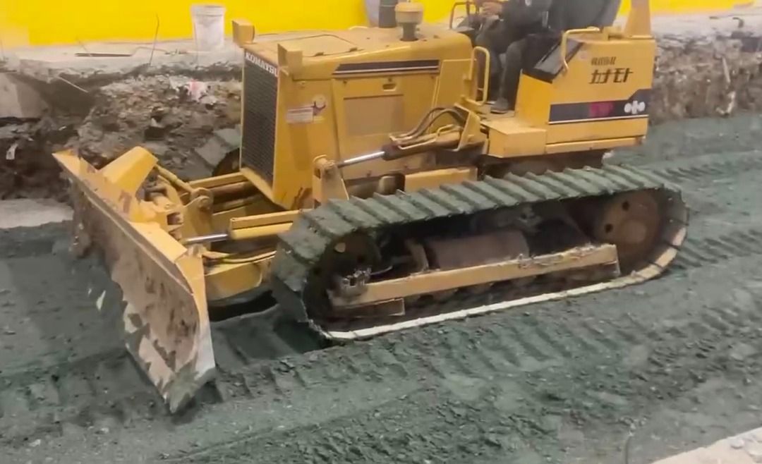 Komatsu Bulldozer D31P-18 (Category: Industrial Equipment) located in Quezon City. Submitted by phoria_trading (Listing ID 1452584444, Image 2). Description: - Brand: Komatsu - Model: D31P-18 - Type: Bulldozer - Color: Yellow - Condition: Good, operational - Features: Robust tracks, powerful blade, suitable for heavy-duty earthmoving tasks.