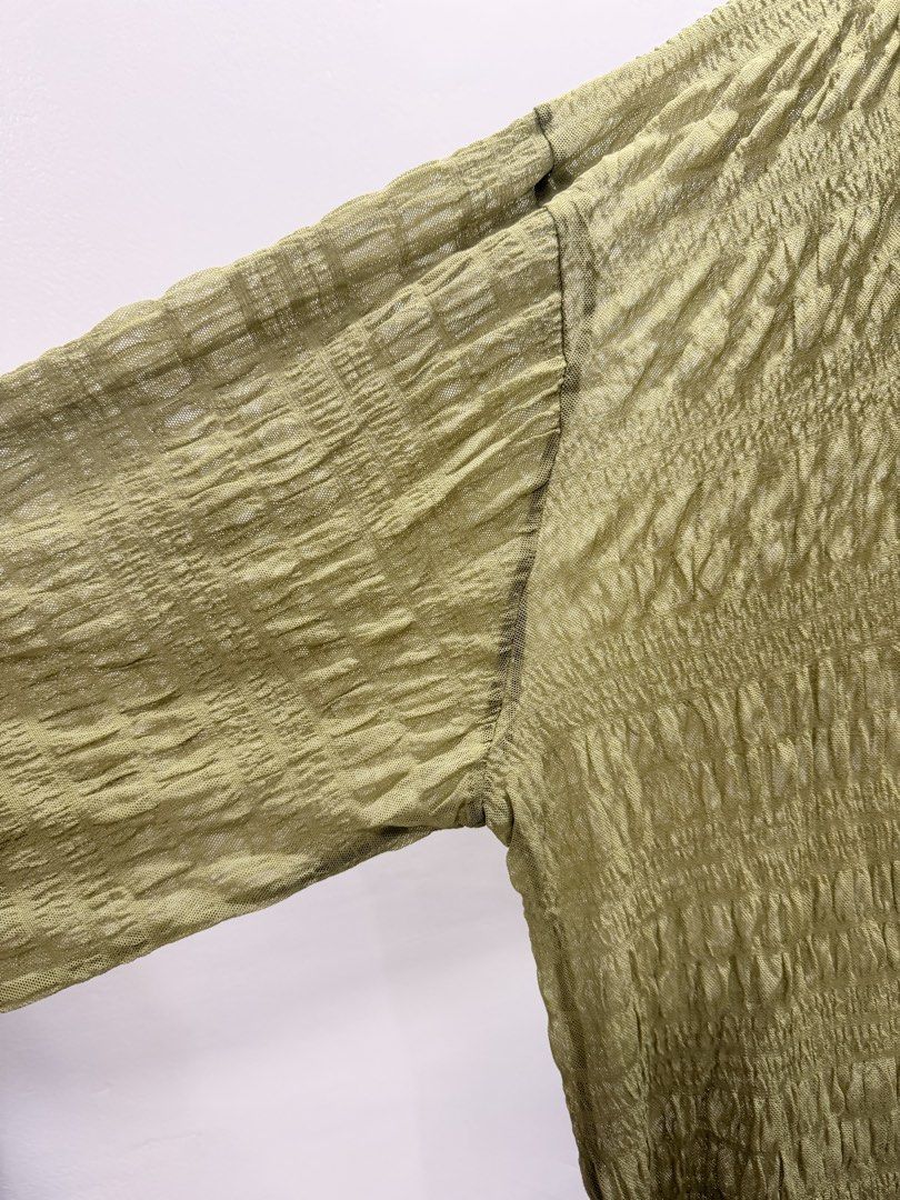 Light Green See-through Textured Long Sleeve Top (Category: Longsleeves) located in Quezon City. Submitted by b43x4 (Listing ID 1452598502, Image 2). Description: - Light green long sleeve see-through top - Unique textured fabric all over - Crew neck style - Loose fit with balloon sleeves - Great for a casual look - Easy to pair with jeans or skirts 27in (69cm) x 25in (64cm). Measured flat..