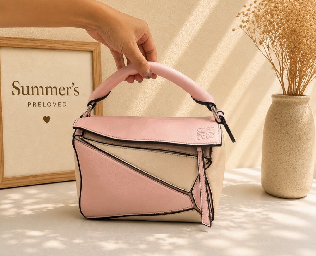 Loewe Puzzle Bag (Category: Luxury Bags & Wallets) located in Taguig. Submitted by summers.preloved (Listing ID 1452691179, Image 1). Description: - Loewe Puzzle Bag - Mini Size - Chic Colorblock Design (Pink & Beige) - Top Handle - Secure Zip Closure - Detachable Strap for Versatile Carrying - Ideal for Everyday Use.