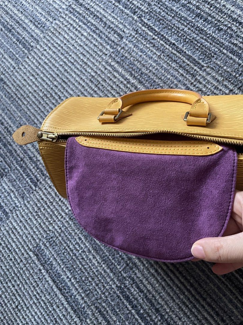 Louis Vuitton Epi Speedy Yellow Handbag (Category: Luxury Bags & Wallets) located in Rizal. Submitted by annelimited_stuffs (Listing ID 1452660464, Image 3). Description: - Yellow Louis Vuitton Speedy Bag - Durable Epi Leather Material - Secure Zipper Closure - Includes a Complimentary Purple Pouch - Minor cosmetic marks on leather (adds character!) - Ideal for everyday carry and stylish outings.