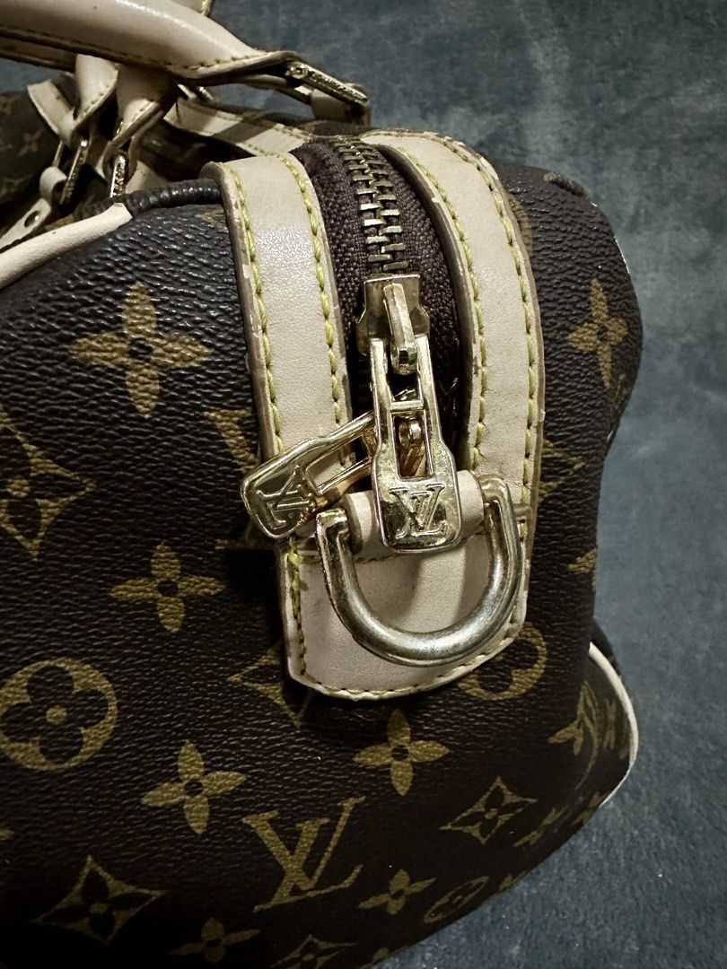 Louis Vuitton Keepall Bandouliere Bag Monogram 40 (Category: Luxury Bags & Wallets) located in Candaba. Submitted by shokgold19 (Listing ID 1452587712, Image 3). Description: - Classic Louis Vuitton Keepall Bandouliere 40 - Monogram canvas with beige leather trim - Gold-tone hardware - Zipper closure - Timeless and versatile for daily use or travel - Shows some signs of wear on leather and hardware.