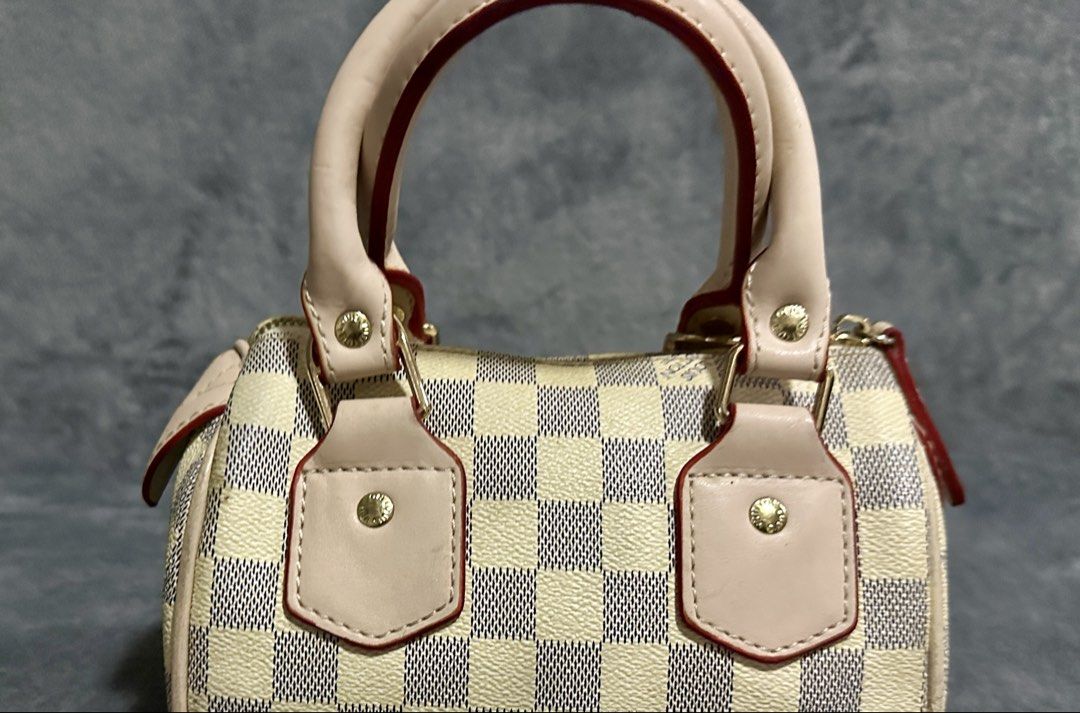 Louis Vuitton Speedy Mini Handbag Damier Azur (Category: Luxury Bags & Wallets) located in Candaba. Submitted by shokgold19 (Listing ID 1452591279, Image 2). Description: - Louis Vuitton Speedy Mini - Classic Damier Azur pattern (beige/blue checkered canvas) - Light beige leather handles and trim with red piping - Gold-tone hardware - Made in France - Compact size, ideal for essentials.