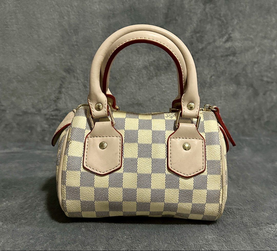 Louis Vuitton Speedy Mini Handbag Damier Azur (Category: Luxury Bags & Wallets) located in Candaba. Submitted by shokgold19 (Listing ID 1452591279, Image 1). Description: - Louis Vuitton Speedy Mini - Classic Damier Azur pattern (beige/blue checkered canvas) - Light beige leather handles and trim with red piping - Gold-tone hardware - Made in France - Compact size, ideal for essentials.