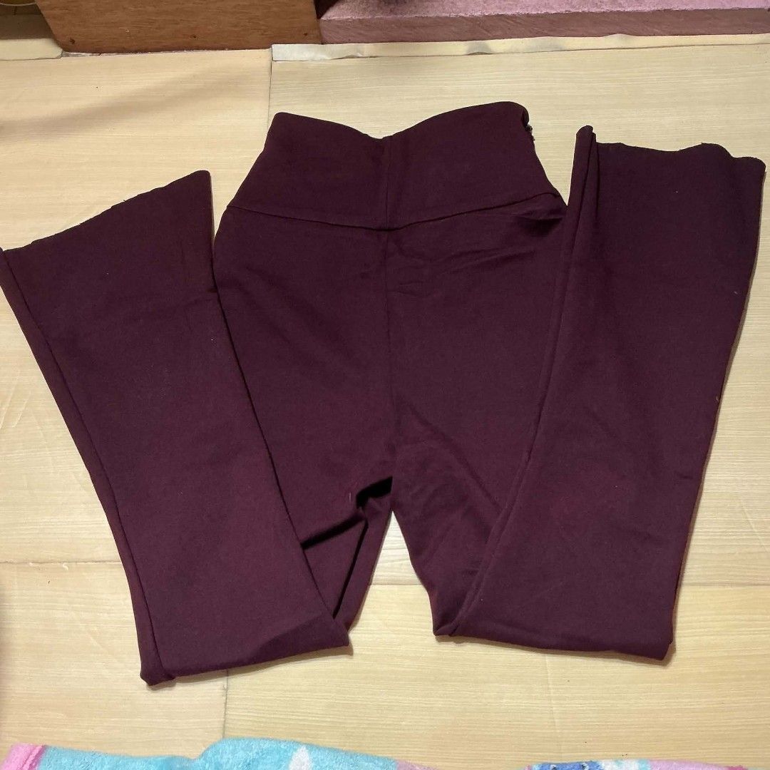 Maroon Flared Yoga Pants High Waisted (Category: Other Bottoms) located in Manila. Submitted by daisyparl (Listing ID 1452678759, Image 1). Description: - High-waisted design - Deep maroon color - Comfortable and stretchy material - Flared leg opening for a stylish look - Versatile for workouts or casual outfits.