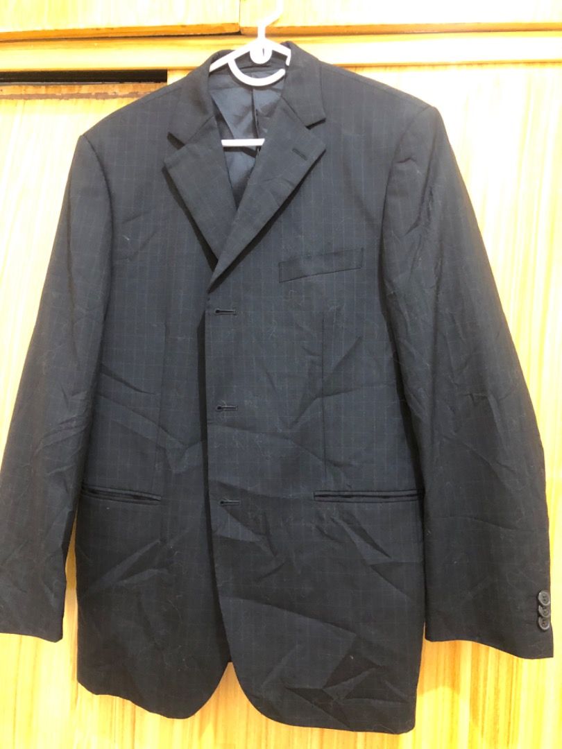 Men's Pinstripe Suit Jacket (Category: Coats, Jackets and Outerwear) located in Makati City. Submitted by chimbashey (Listing ID 1452513534, Image 3). Description: - Oversized for women - Classic men's suit jacket - Subtle pinstripe pattern - Three-button front closure - Two flap pockets on the front - Button details on the cuffs - Sharp and professional look - Ideal for formal occasions or business wear.