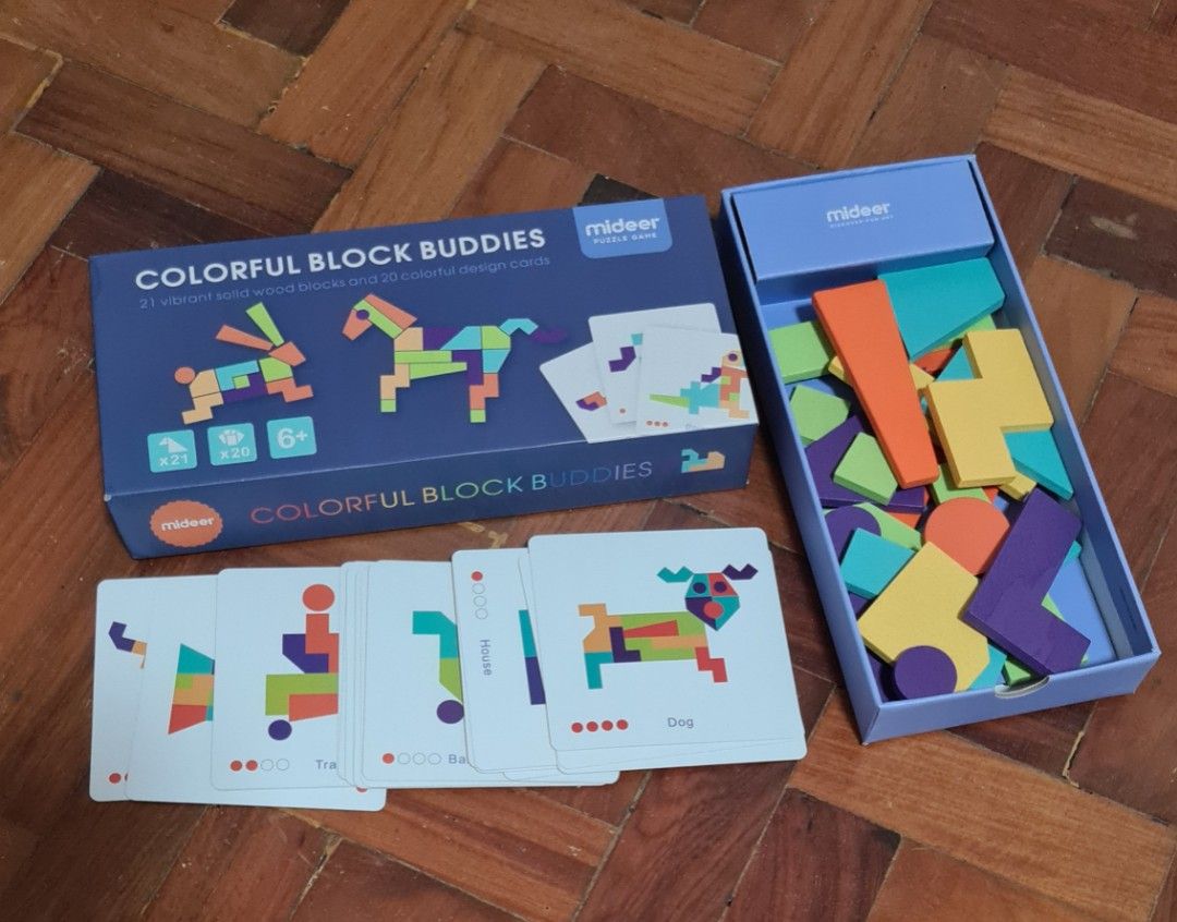 Mideer Colorful Block Buddies Puzzle Game (Category: Educational & Learning Toys) located in Manila. Submitted by lc_declut (Listing ID 1452608510, Image 1). Description: - Mideer Colorful Block Buddies puzzle game - Includes 31 geometric blocks and design cards - Kids can build animals and other shapes by following the cards - Great for developing creativity and problem-solving skills - All pieces are complete and in the box.