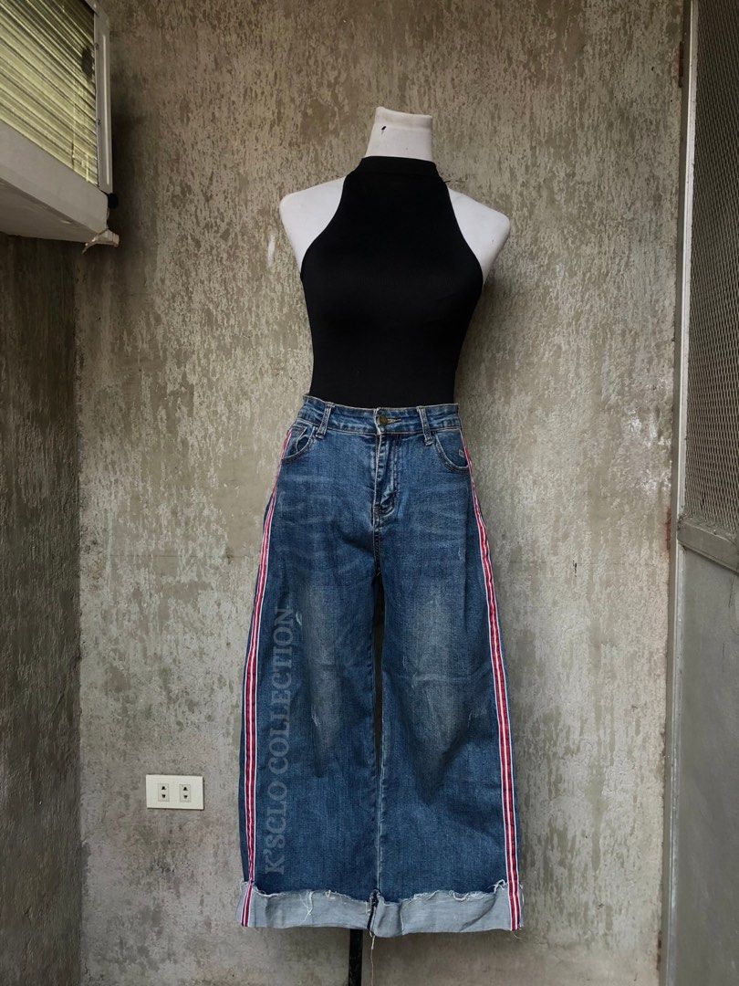 Mom Jeans (Category: Jeans) located in Muntinlupa City. Submitted by ksclocollection (Listing ID 1452674989, Image 2). Description: Blue denim jeans, size medium, with red and white side stripes. Features cuffed hem, distressed front, and button/zip closure. Perfect for casual outfits. 29-30 length 38.