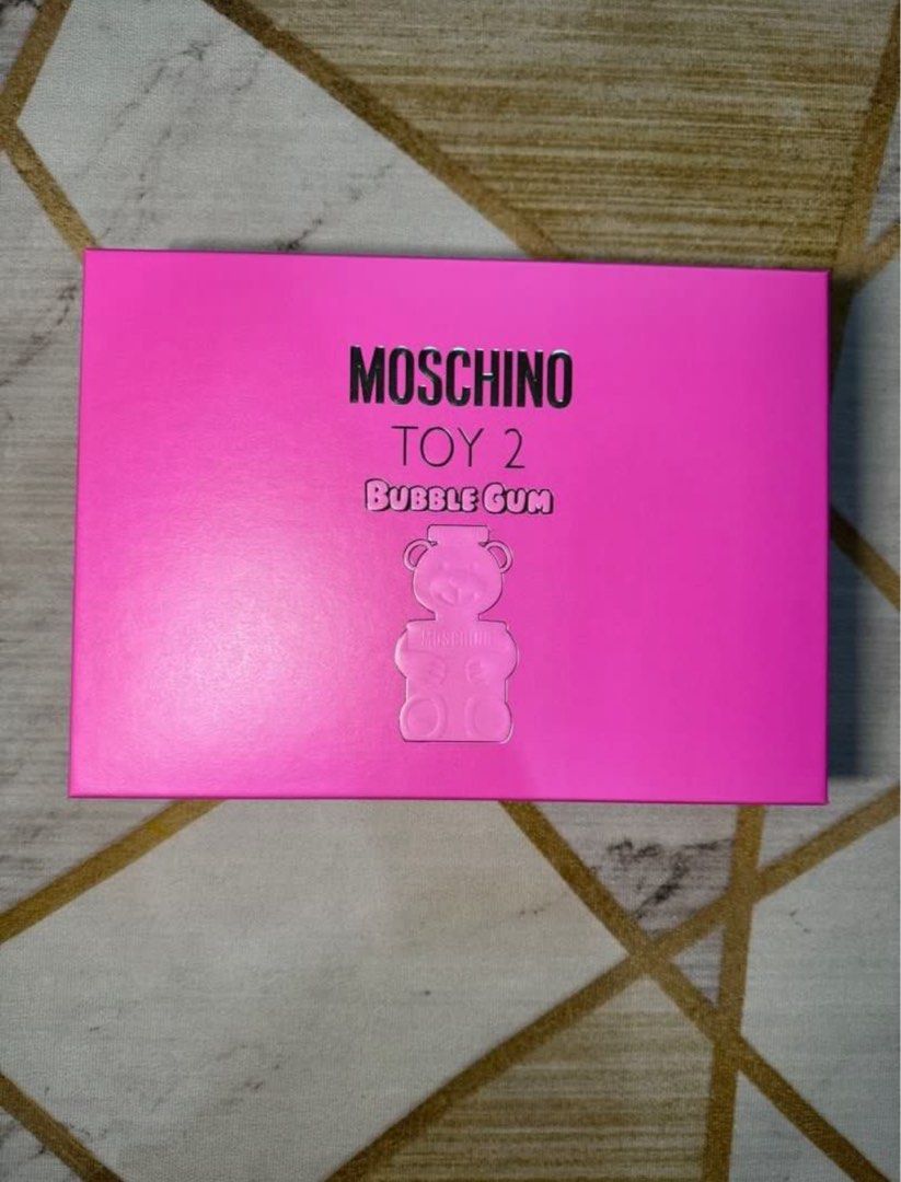 Moschino Toy 2 Bubble Gum Perfume Gift Set (Category: Fragrance & Deodorants) located in Paranaque City. Submitted by julia.decluttering (Listing ID 1452597074, Image 2). Description: - Moschino Toy 2 Bubble Gum Gift Set - Bright pink packaging - Set includes: Shower Gel, Body Lotion, Eau de Toilette - Ideal for gifting or personal indulgence - All items are brand new and in their original box.