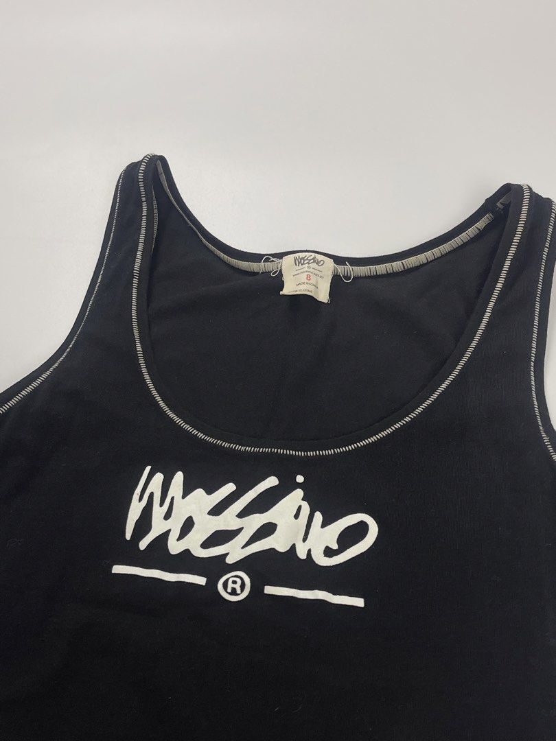 Mossimo Graphic Contrast Stitch Tank Top (Black/White) (Category: Sleeveless) located in Cagayan de Oro. Submitted by kmcurations (Listing ID 1452639224, Image 2). Description: Mossimo Graphic Contrast Stitch Tank Top (Black/White) • Price: PHP 200 • Brand: Mossimo • Features: • Flattering scoop neckline and thick tank straps. • Distinctive contrast stitching details for a vintage streetwear feel. • Stretchy, comfortable cotton-elastane fabric kn