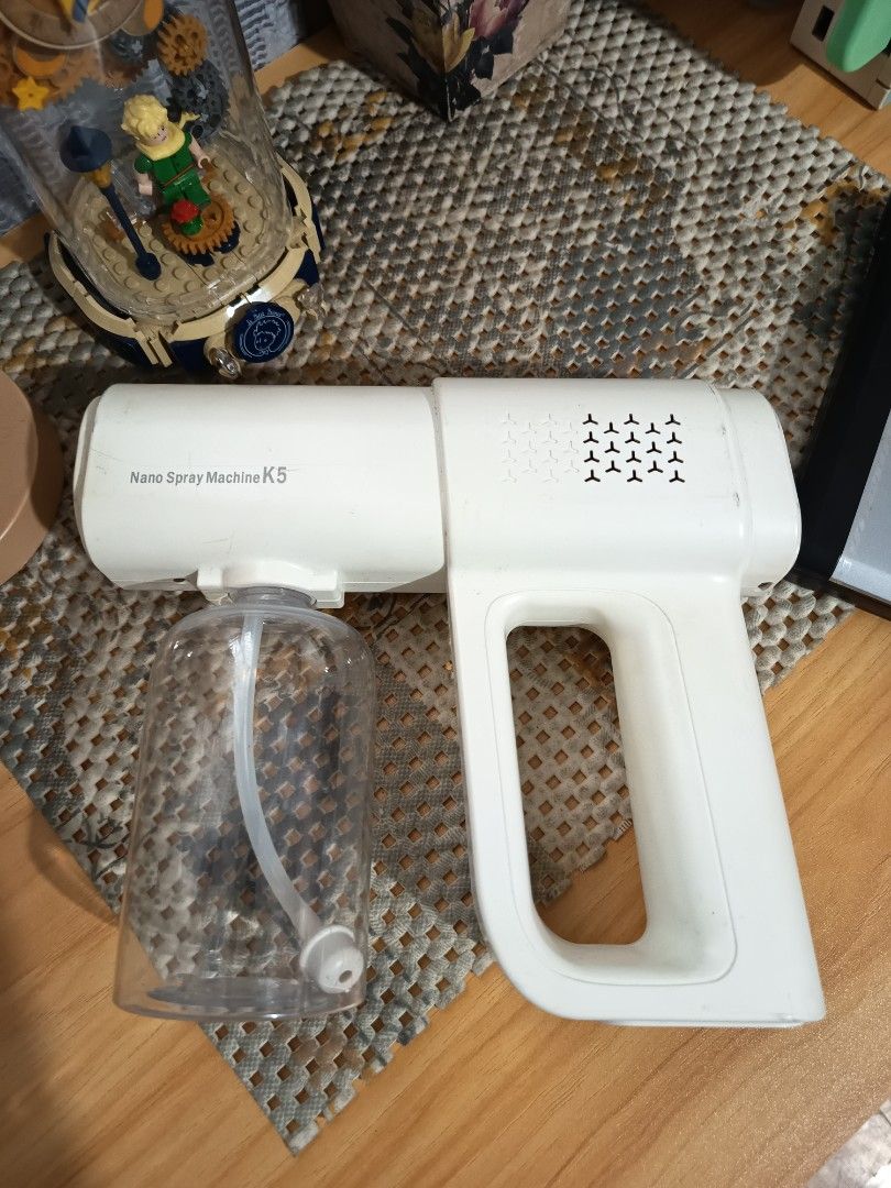 Nano Spray Machine K5 Disinfectant Sprayer (Category: Home Fragrance) located in Manila. Submitted by heyjka_19xx (Listing ID 1452617648, Image 2). Description: - K5 White Nano Spray Machine - Adjustable low and high spray settings - Detachable clear bottle for disinfectant - Ideal for sanitizing spaces - Easy to hold and operate - Minor scuffs on the body from use.