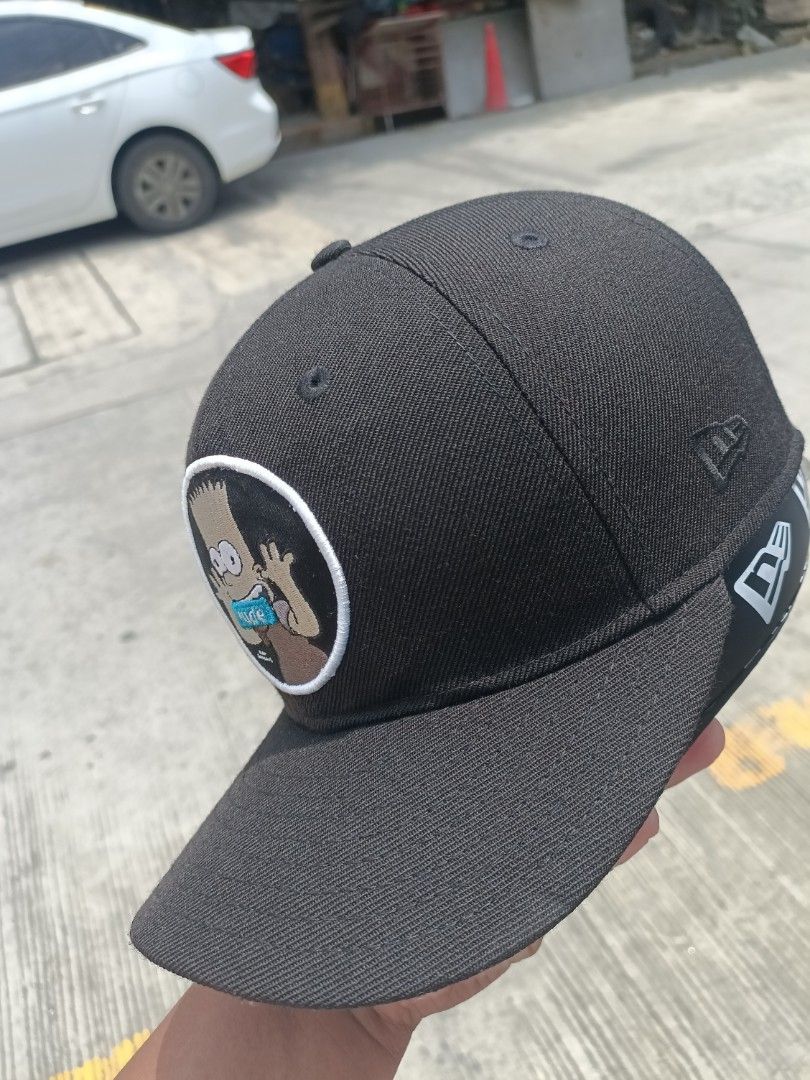New Era 9FIFTY Bart Simpson "Rude" Snapback Cap (Category: Caps & Hats) located in Manila. Submitted by thriftnival (Listing ID 1452572444, Image 3). Description: - Brand: New Era - Style: 9FIFTY Snapback Cap - Color: Black - Front Graphic: Embroidered Bart Simpson with "Rude" text - Inner Detail: "I'll be good sometimes" text - Size: Medium/Large - Ideal for: Any fan of The Simpsons.