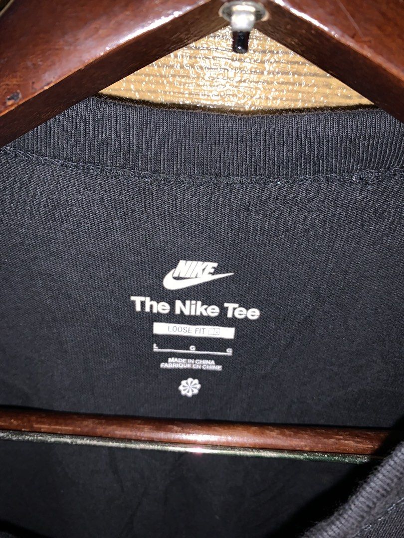 Nike tshirt (Category: Tshirts & Polo Shirts ) located in Valenzuela. Submitted by Caloooy (Listing ID 1452656773, Image 3). Description: Black Nike tee with "HOW I KNOW MY" printed on the front. The back features a colorful graphic design with various letters and Nike logos. It is a loose fit, size L. Made in China. For 400+sf.
