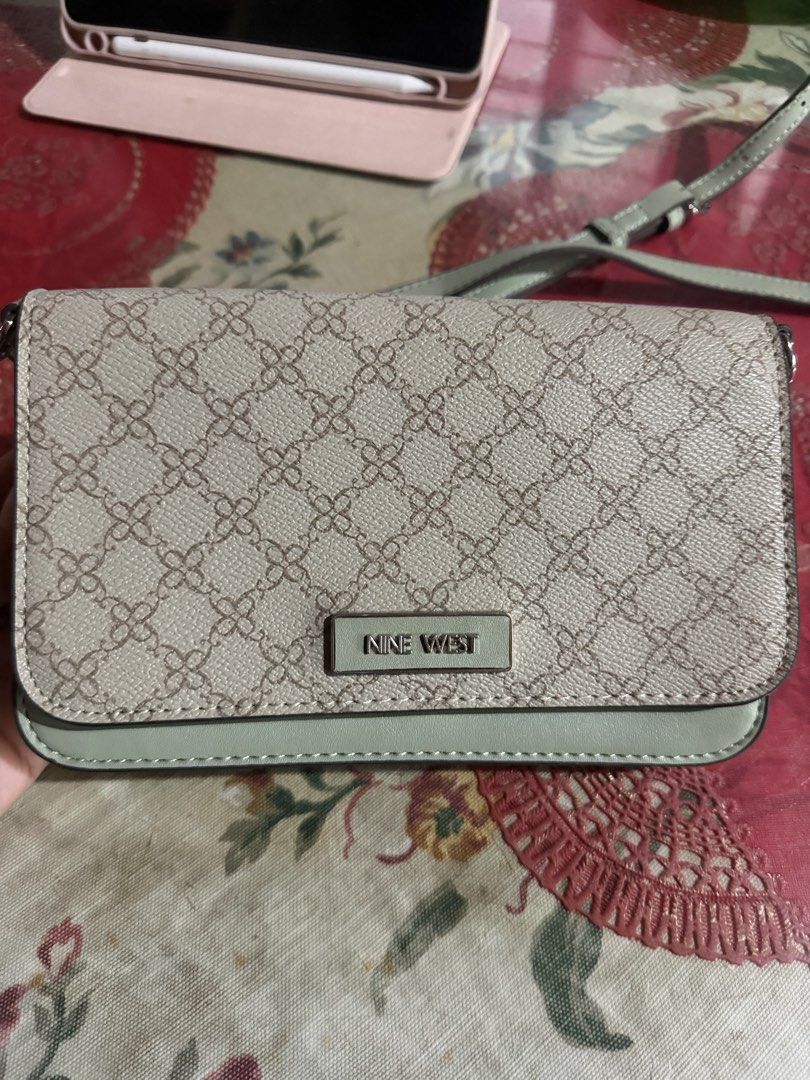 Nine West Wallet Clutch with Strap (Category: Luxury Bags & Wallets) located in San Fernando. Submitted by japanvintageaccessories (Listing ID 1452613958, Image 1). Description: - Brand: Nine West - Color: Beige and Light Green - Style: Wallet Clutch - Exterior: Patterned - Closure: Snap - Interior: Card slots, zippered compartment - Features: Clear ID window on front flap - Additional: Detachable strap included.