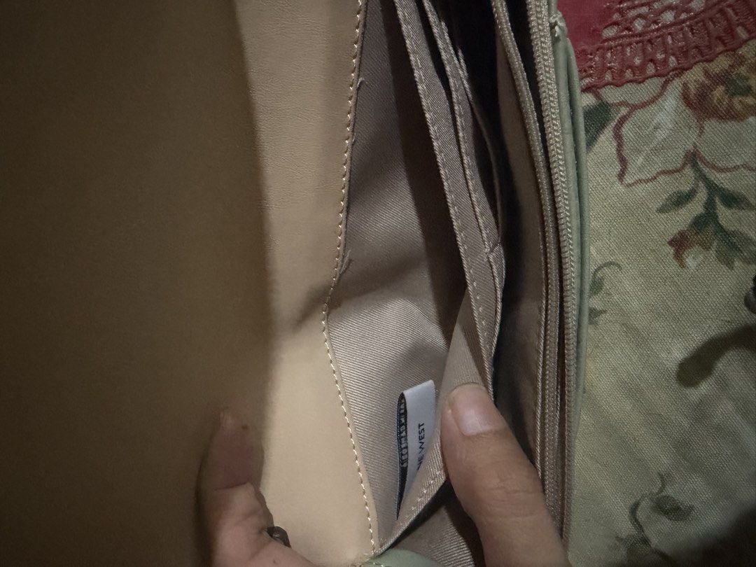 Nine West Wallet Clutch with Strap (Category: Luxury Bags & Wallets) located in San Fernando. Submitted by japanvintageaccessories (Listing ID 1452613958, Image 3). Description: - Brand: Nine West - Color: Beige and Light Green - Style: Wallet Clutch - Exterior: Patterned - Closure: Snap - Interior: Card slots, zippered compartment - Features: Clear ID window on front flap - Additional: Detachable strap included.